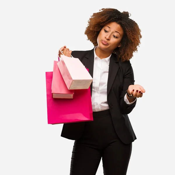 Young Black Woman Holding Shopping Bags Confused Doubtful — Stock Photo, Image