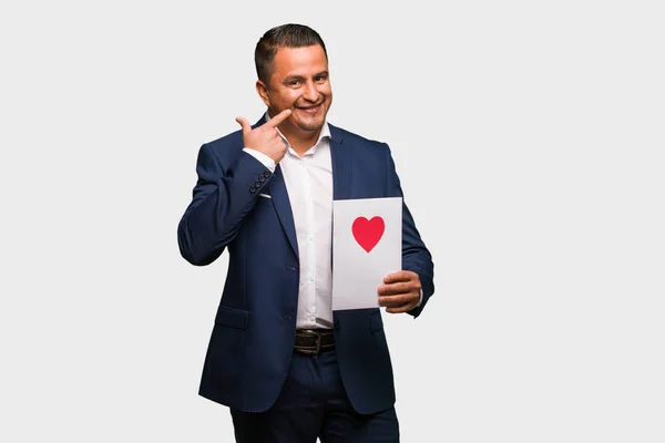 Middle Aged Latin Man Celebrating Valentines Day Smiles Pointing Mouth — Stock Photo, Image
