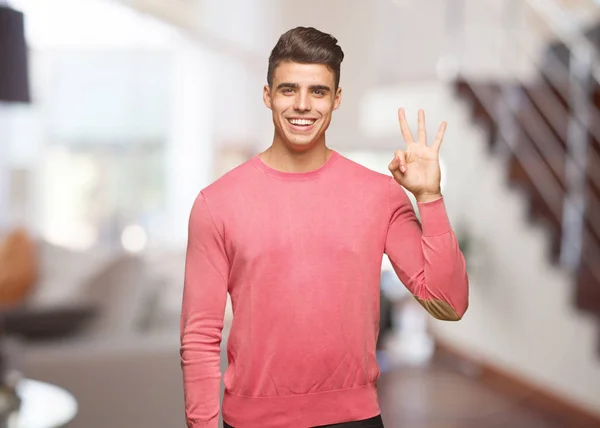 Joven Hombre Divertido Mostrando Número Tres —  Fotos de Stock