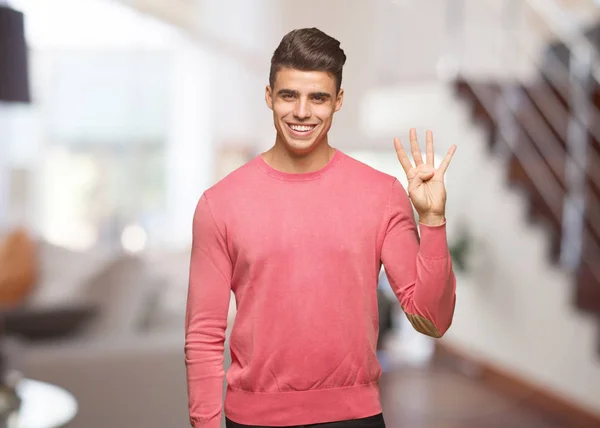 Young Funny Man Showing Number Four — Stock Photo, Image