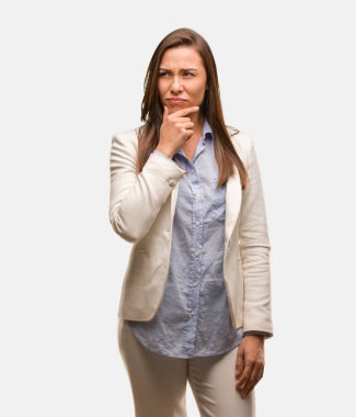 Caucasian business young woman doubting and confused clipart