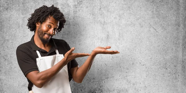 Handsome African American Baker Holding Something Hands Showing Product Smiling — Stock Photo, Image