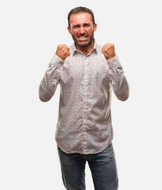 Caucasian man on grey brackground screaming very angry and aggressive clipart