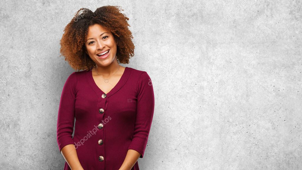 Young black afro woman cheerful with a big smile