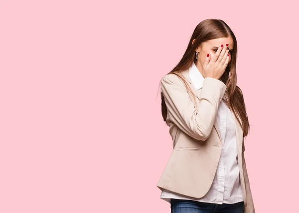 Young caucasian business woman embarrassed and laughing at the same time