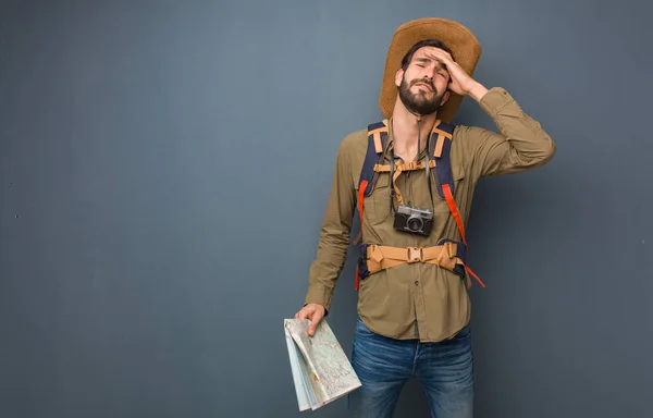 Traveler man crossing arms, smiling and relaxed