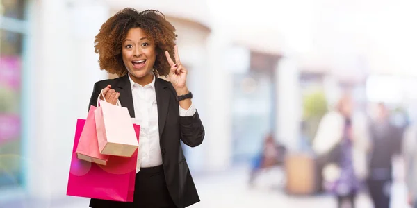 Young Black Woman Holding Shopping Bags Fun Happy Doing Gesture — Stock Photo, Image