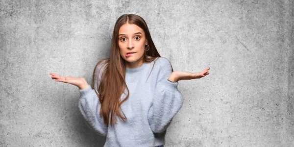 Young caucasian woman confused and doubtful