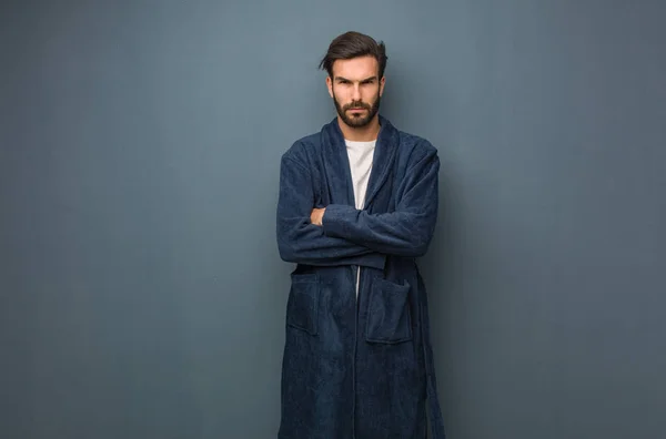 Man wearing pajama crossing arms relaxed