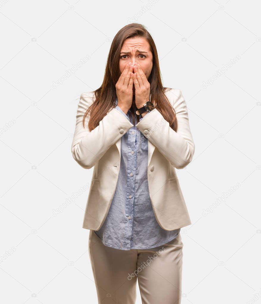 Caucasian business young woman very scared and afraid hidden