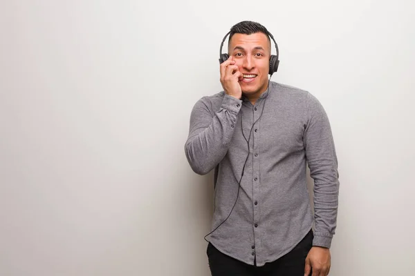 Young Latin Man Listening Music Biting Nails Nervous Very Anxious — Stock Photo, Image