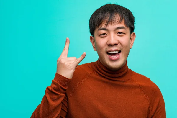 Young Chinese Man Doing Rock Gesture — Stock Photo, Image