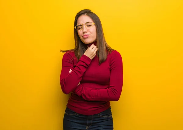 Young intellectual woman coughing, sick due a virus or infection