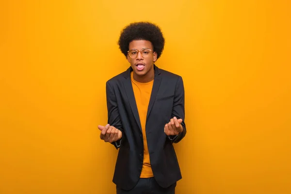 Young Business African American Man Orange Wall Doing Gesture Need — Stock Photo, Image