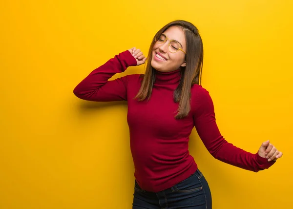 Young intellectual woman dancing and having fun