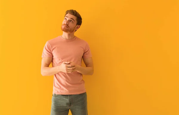 Young redhead man dreaming of achieving goals and purposes