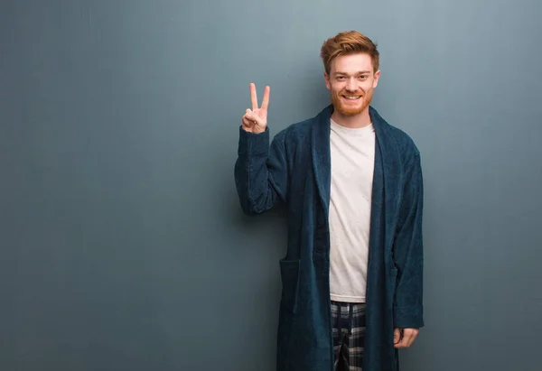 Young Redhead Man Pajama Fun Happy Doing Gesture Victory — 스톡 사진