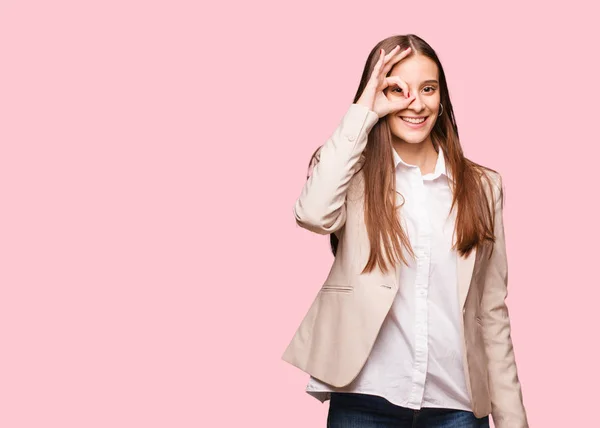 Young caucasian business woman confident doing ok gesture on eye