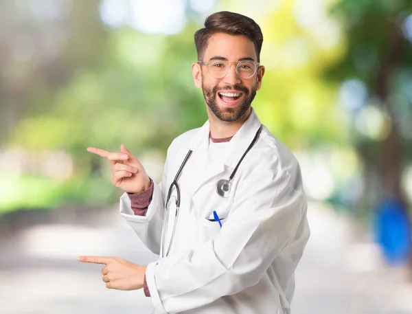 Young Doctor Man Pointing Side Finger — Stock Photo, Image