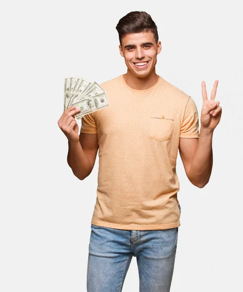 Jovem Segurando Dólares Fazendo Gesto Vitória — Fotografia de Stock