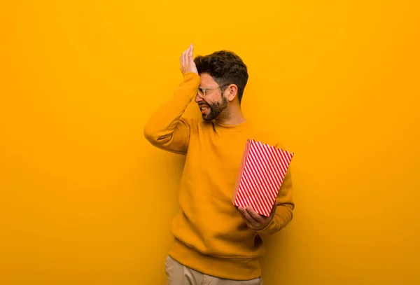 Young Man Holding Popcorns Forgetful Realize Something — Stock Photo, Image