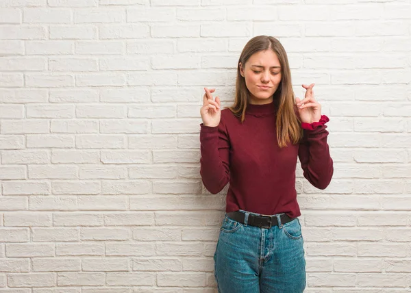 Young Cool Woman Bricks Wall Crossing Fingers Having Luck — Stock Photo, Image