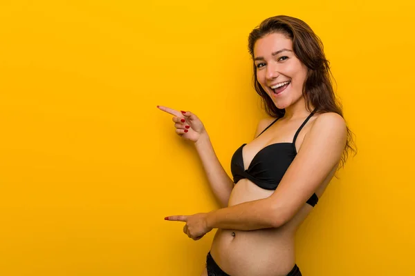 Young European Woman Wearing Bikini Excited Pointing Forefingers Away — Stock Photo, Image