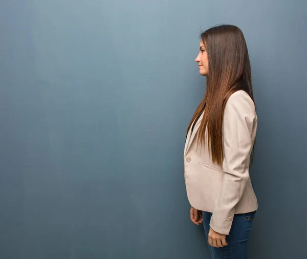 Young business woman on the side looking to front