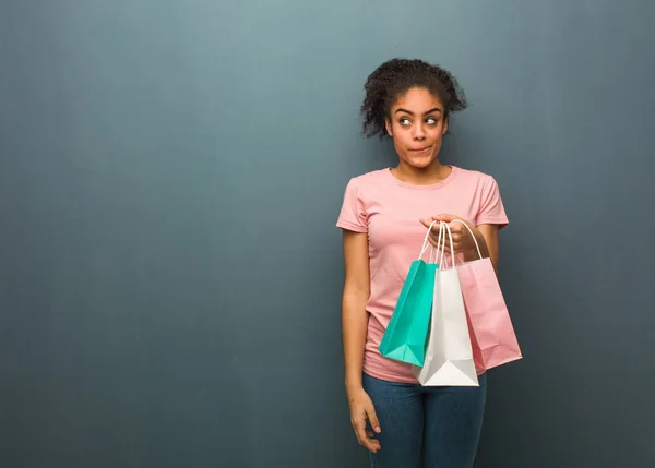 Young Black Woman Thinking Idea She Holding Shopping Bags — 스톡 사진