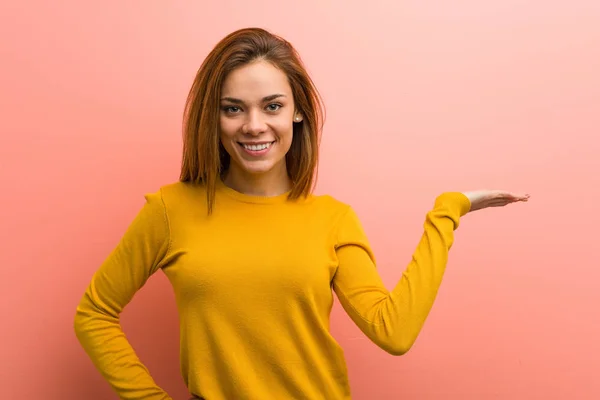 Young Pretty Young Woman Showing Copy Space Palm Holding Another — Stok fotoğraf