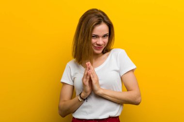 Young natural caucasian woman making up plan in mind, setting up an idea.