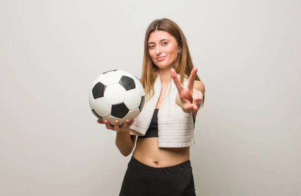 Young Fitness Russian Woman Showing Number Two Holding Soccer Ball — Stock Photo, Image