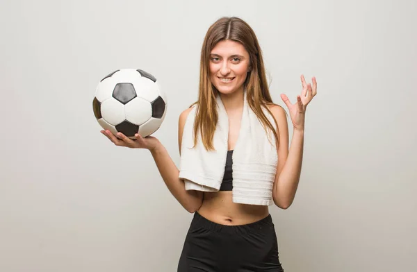 Young Fitness Russian Woman Angry Upset Holding Soccer Ball — 스톡 사진