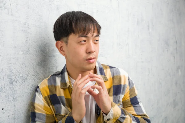 Young Chinese Man Face Closeup Devising Plan — Stock Photo, Image