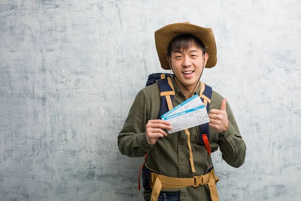Young Explorer Chinese Man Holding Air Tickets Smiling Raising Thumb — Stock Photo, Image