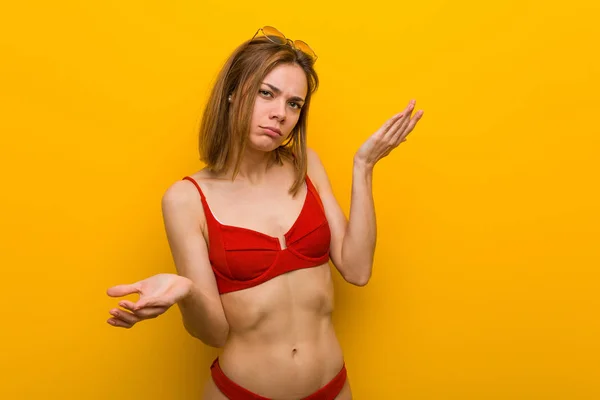 Young Caucasian Woman Wearing Bikini Sunglasses Doubting Two Options — 스톡 사진