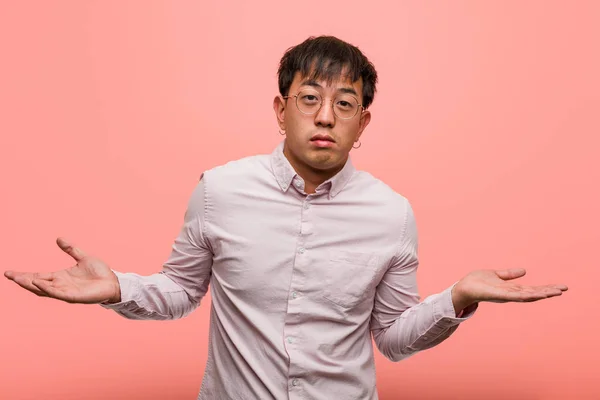 Young Chinese Man Doubting Shrugging Shoulders — Stock Photo, Image