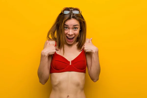 Young Caucasian Woman Wearing Bikini Sunglasses Surprised Pointing Herself Smiling — Stok fotoğraf