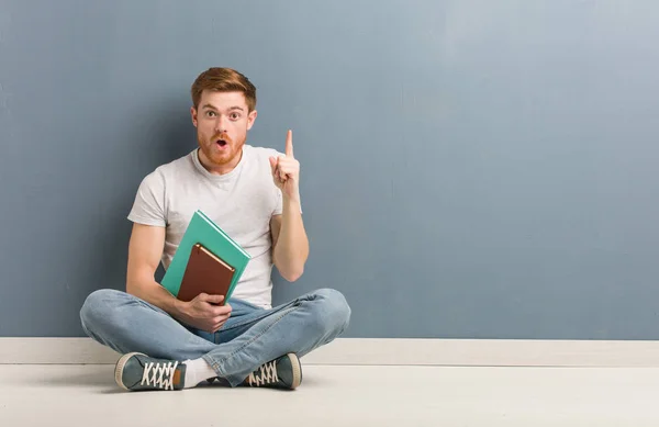 Young Redhead Student Man Sitting Floor Having Great Idea Concept — Stock Photo, Image