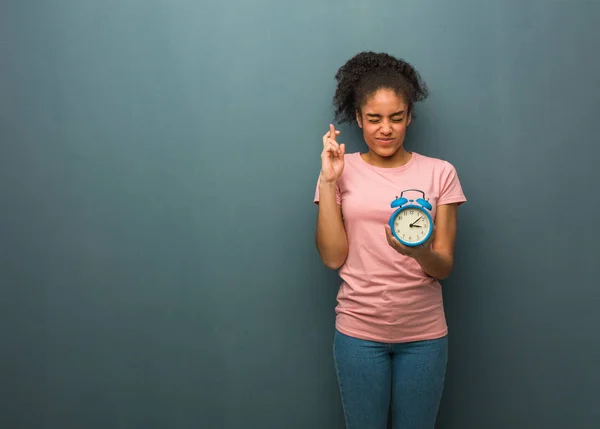 Young Black Woman Crossing Fingers Having Luck She Holding Alarm — 스톡 사진