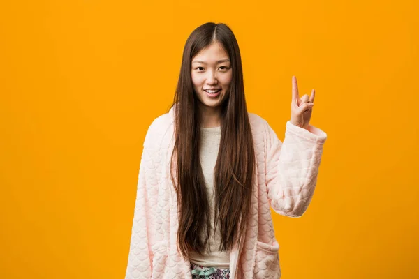 Young Chinese Woman Pajama Showing Horns Gesture Revolution Concept — 스톡 사진