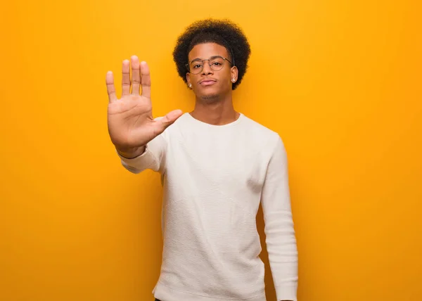 Young African American Man Orange Wall Putting Hand Front — Stock Photo, Image