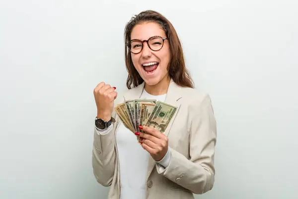 Young European Business Woman Holding Dollar Banknotes Cheering Carefree Excited — 스톡 사진