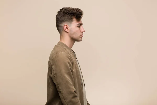 Young Caucasian Man Wearing Brown Jacket Gazing Left Sideways Pose — Stock Photo, Image