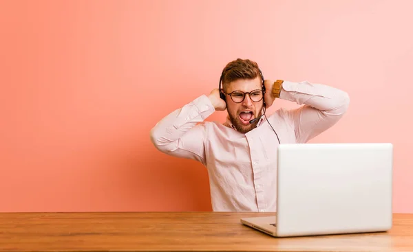 Young Man Working Call Center Covering Ears Hands Trying Hear — 스톡 사진