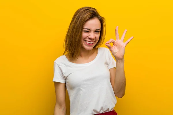 Young Natural Caucasian Woman Winks Eye Holds Okay Gesture Hand — 스톡 사진
