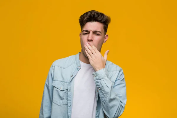 Young Handsome Student Wearing Denim Shirt Yawning Showing Tired Gesture — 스톡 사진