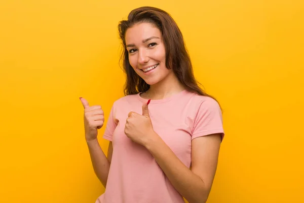 Young European Woman Isolated Yellow Background Raising Both Thumbs Smiling — 스톡 사진