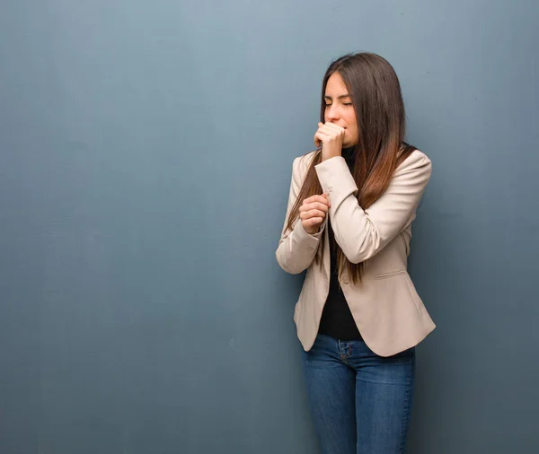 Young business woman coughing, sick due a virus or infection