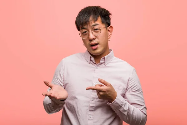 Young Chinese Man Holding Something Hand — Stock Photo, Image